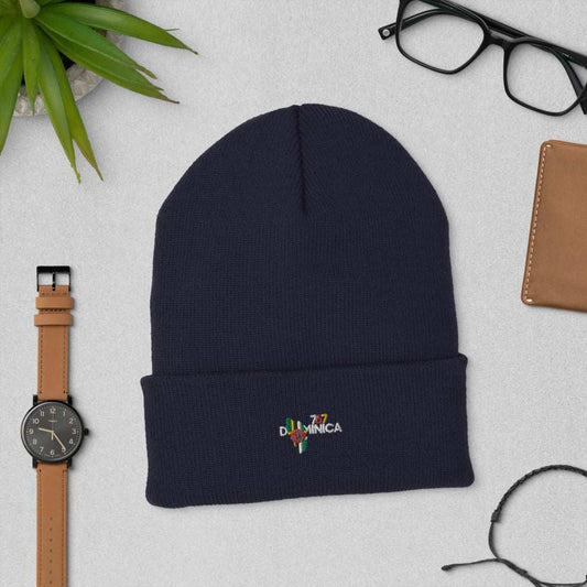 Dominica InspiredCuffed Beanie in navy ribbed acrylic, featuring a folded cuff and small colorful Dominica logo